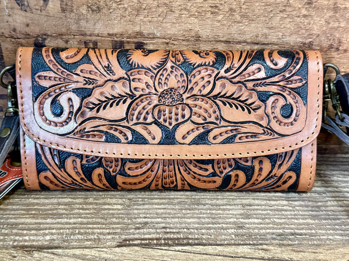 Cowhide tooled leather wallet front flap, floral scroll tooling, and snap closure