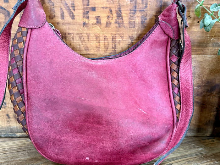 Magenta leather hobo purse front with braided trim on the sides, American Darling