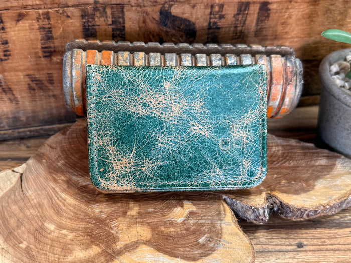 Turquoise distressed leather card wallet with beaded trim and front stitching