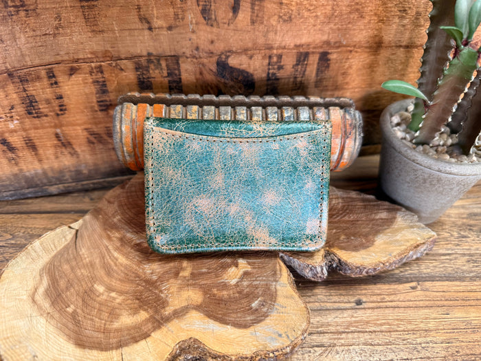Turquoise distressed leather card wallet top view with beaded trim