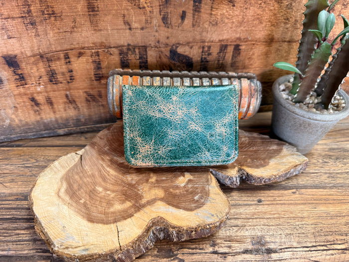 Turquoise distressed leather card wallet with decorative beaded trim and stitched edges