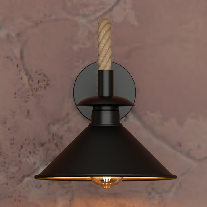 Black wall-mounted lamp with a textured wall background