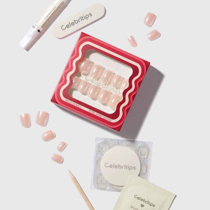 Celebritips Micro French Glaze press-on nails in nude pink with application tools on white background
