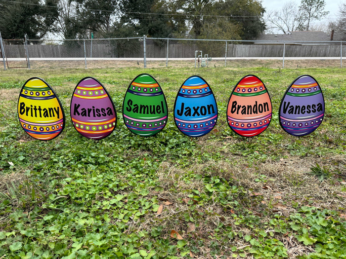 Six different Easter Egg personalized yard signs with stakes. Yellow, purple, green, blue, ed and violet easter egg decor for lawn, gardens, porches, walkways and driveways for sale.