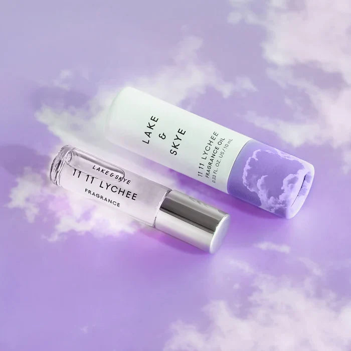 Lake & Skye 11 11 Lychee rollerball and tube packaging on purple background