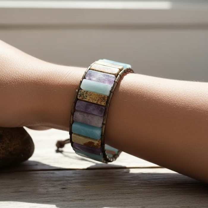 Model's wrist wearing gemstone wrap bracelet
