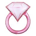 A pink, diamond-shaped balloon, resembling a rose gold ring, designed for parties such as engagement celebrations or bridal showers.