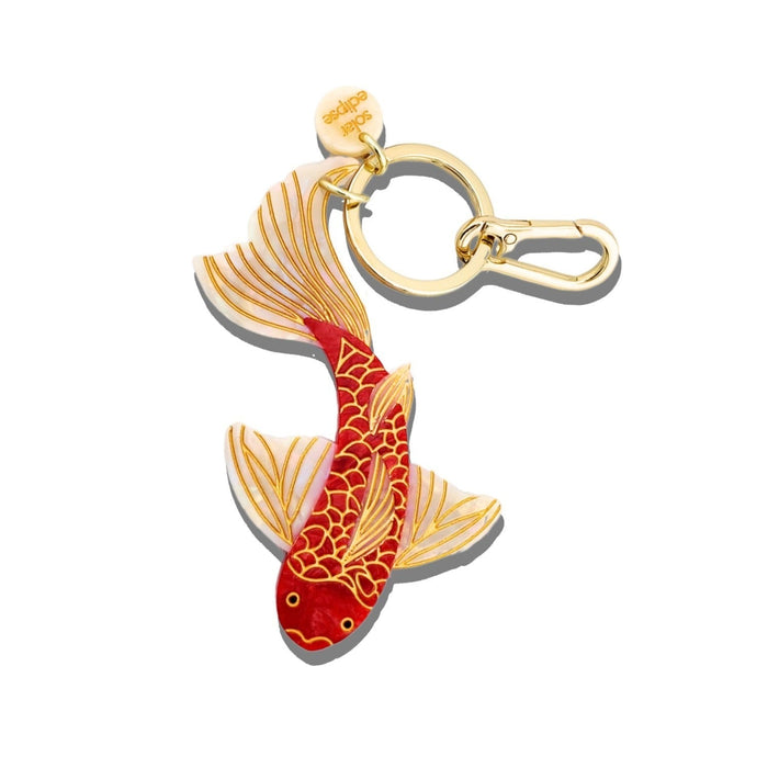 Hand-painted red and gold koi fish bag charm with gold keychain clip on white background